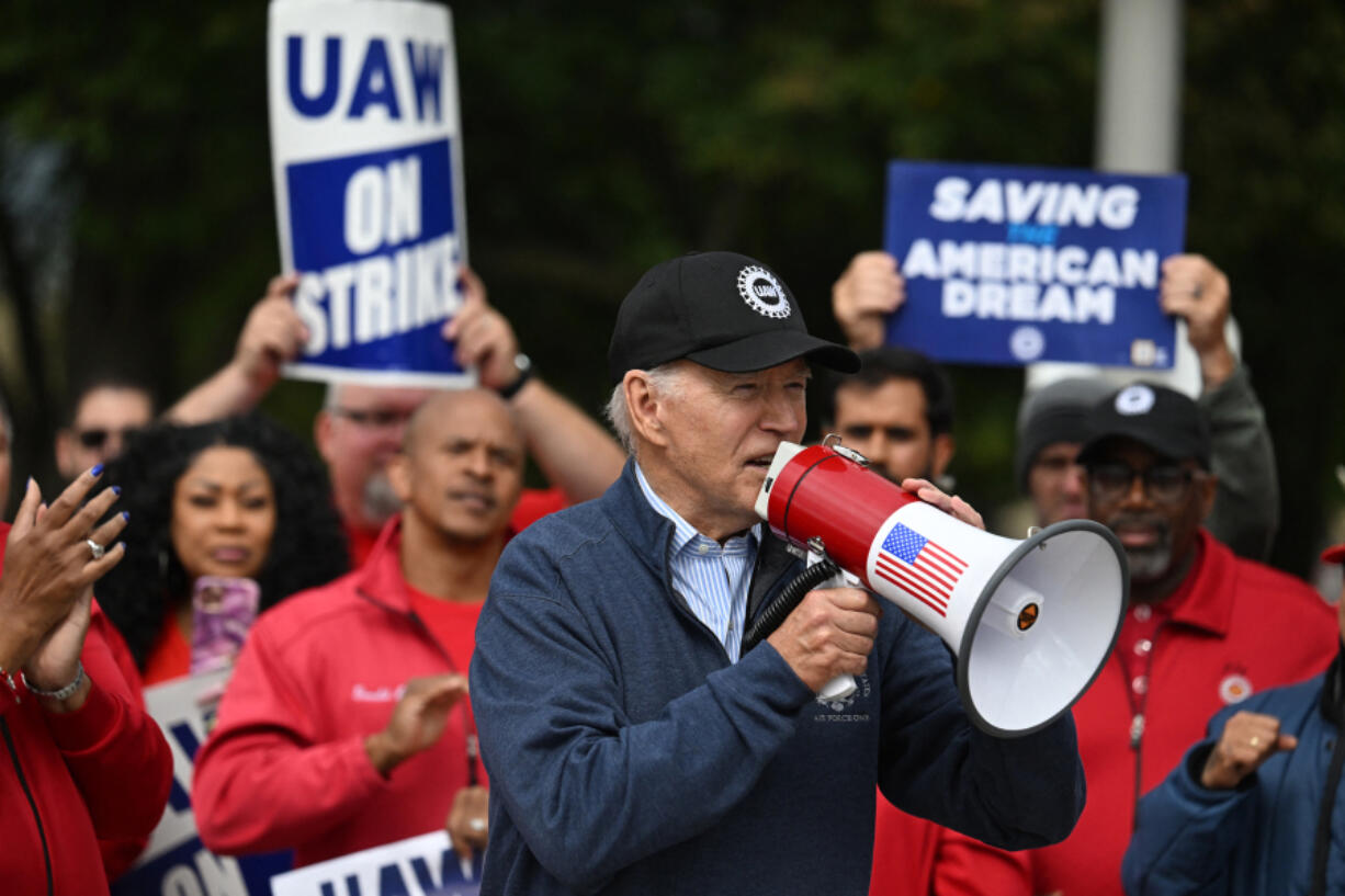 U.S. President Joe Biden addresses striking members of the United Auto Workers union at a picket line outside a General Motors Service Parts Operations plant in Belleville, Michigan, on Sept. 26, 2023.