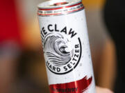 This Aug. 8, 2019, photo shows a White Claw in New Orleans. Sales of White Claw and other fruity, alcoholic seltzers soared this summer as drinkers looked for lighter, healthier options.