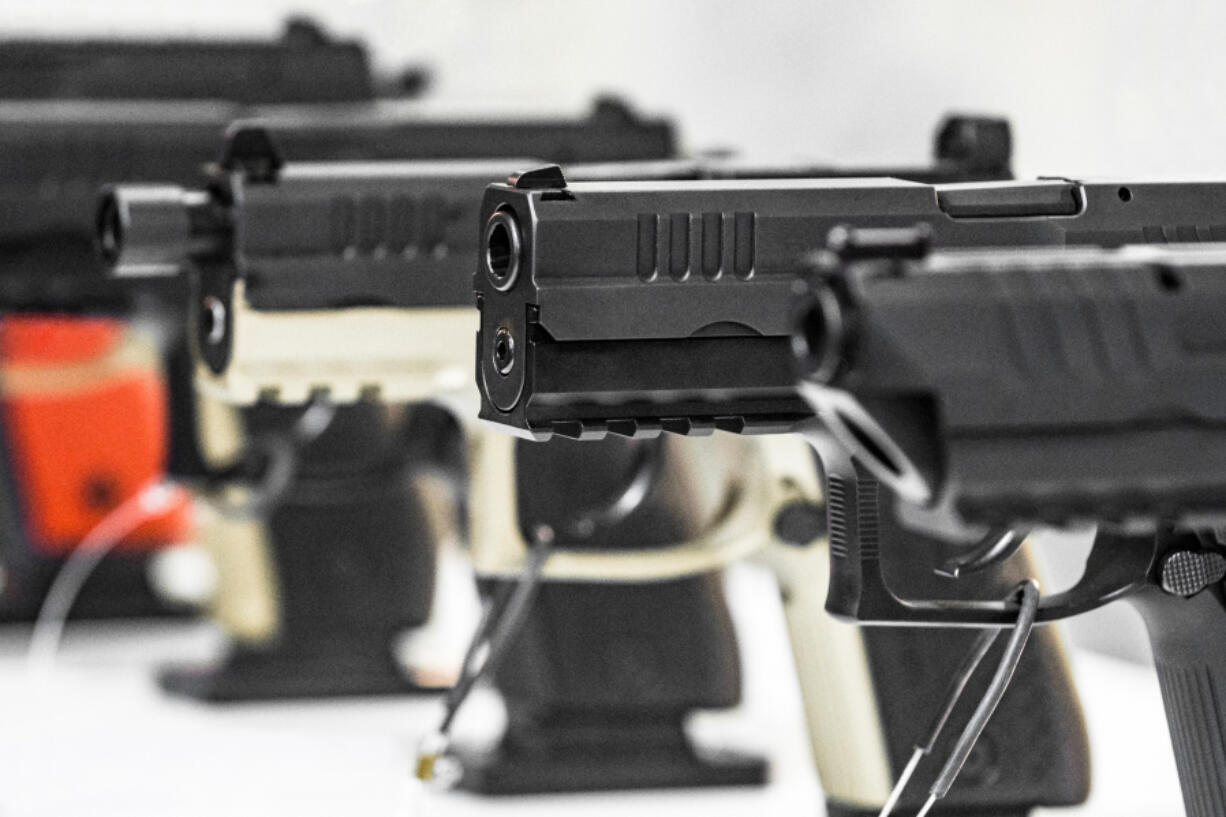 Semi-automatic pistols  on display at a gun shop.