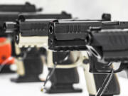 Semi-automatic pistols  on display at a gun shop.