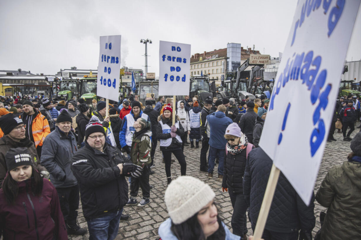 Tractors are parked in market square during &ldquo;a food march&rdquo; in Kuopio, Finland, Friday, as farmers protest against perceived inequalities in food production profits.