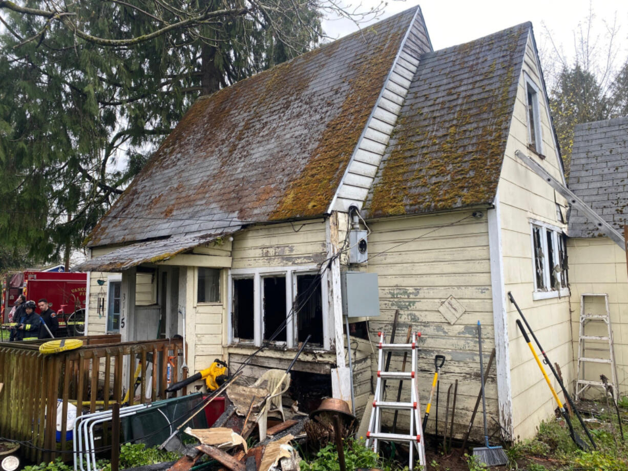 A house that caught fire Wednesday morning in the Fourth Plain Village neighborhood. Two cats died in the fire and one person was displaced, the fire department said.