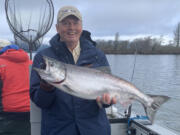 A client of guide Bob Rees displays a spring Chinook taken last year. Fishing so far this spring has been slow, and anglers only have a few days before the Columbia River closes.