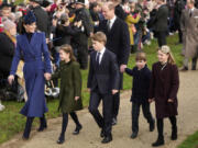 Britain&rsquo;s Kate, Princess of Wales, from left, Princess Charlotte, Prince George, William, the Prince of Wales, Prince Louis and Mia Tindall arrive Dec. 25 to attend the Christmas Day service at St. Mary Magdalene Church in Sandringham in Norfolk, England.