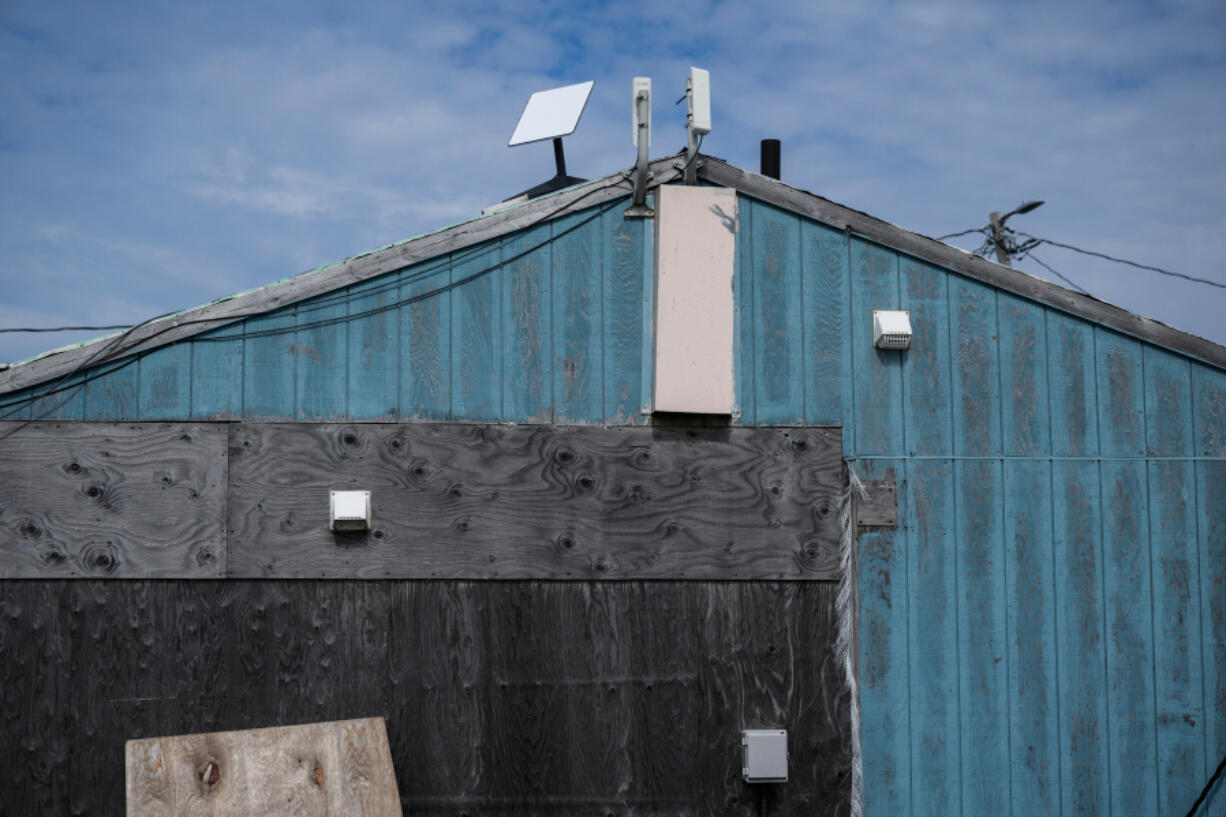 Starlink satellite internet equimpment is mounted to a home in Eek, a village in Southwest Alaska, on Aug. 2, 2023.