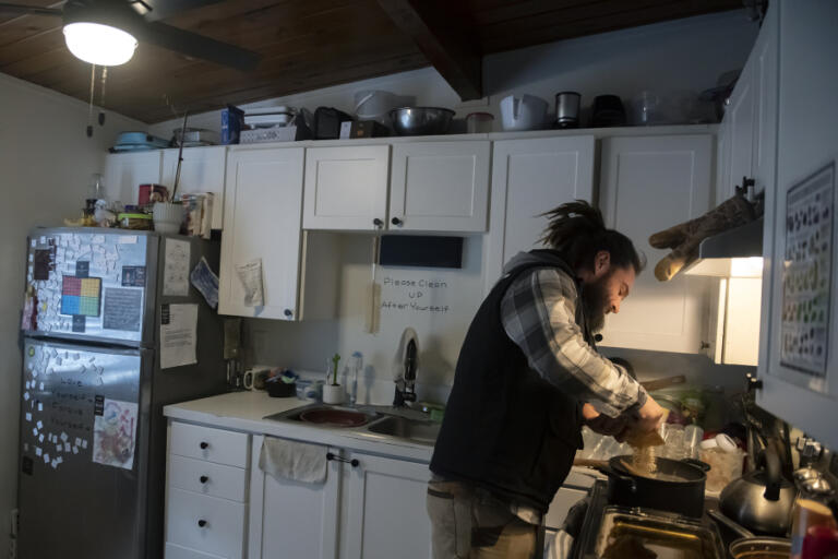 Ryan Tabor, 38, of Vancouver whips up some oatmeal for his family in their kitchen Feb. 15.