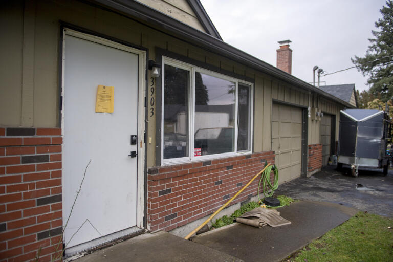 A February eviction notice for a neighbor is pasted next door to the Zazueta family&rsquo;s unit in a duplex in Vancouver.