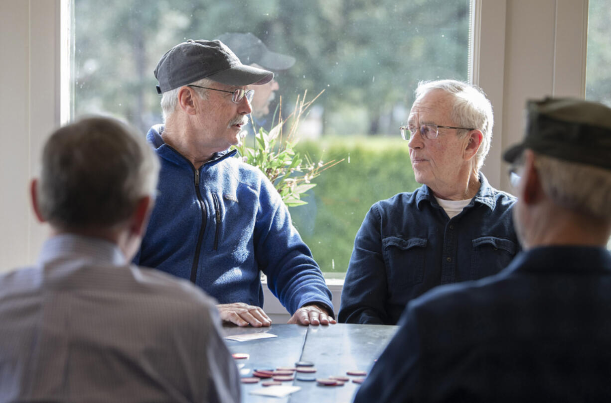 Mike Cullivan, left, chats with Jack Connolly during a poker game at Orchard Hills Country Club in Washougal. &ldquo;We like and respect each other,&rdquo; Cullivan said of his poker buddies.