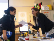 Paraeducator Michelle Dever, right, talks with Daybreak Middle School student Jayleona La Tour. Dever leads the school&rsquo;s social and emotional learning center.