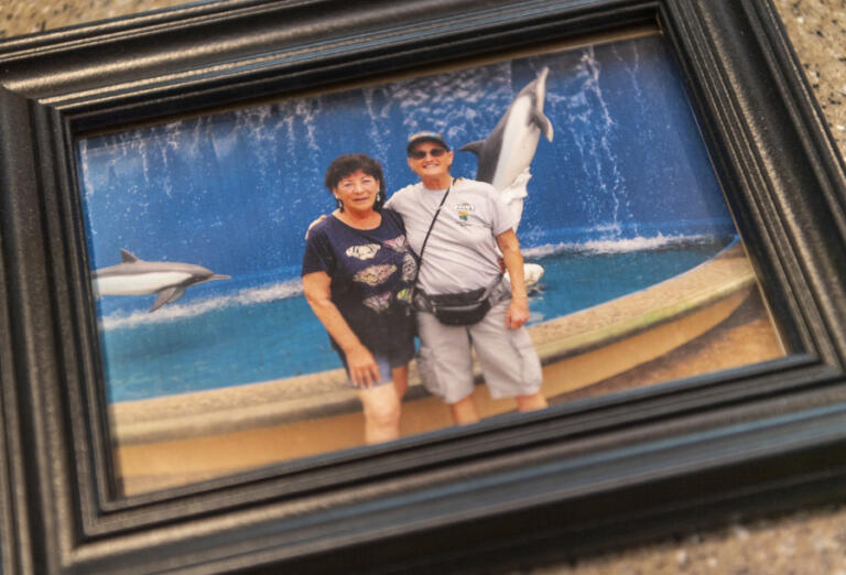 A framed photo of Dale Manheimer, left, and Kathy Driver from 2014 sits on the counter inside Kathy Driver&rsquo;s RV. The two met in south Florida in the early 1980s and shared a loving relationship that lasted close to 40 years.