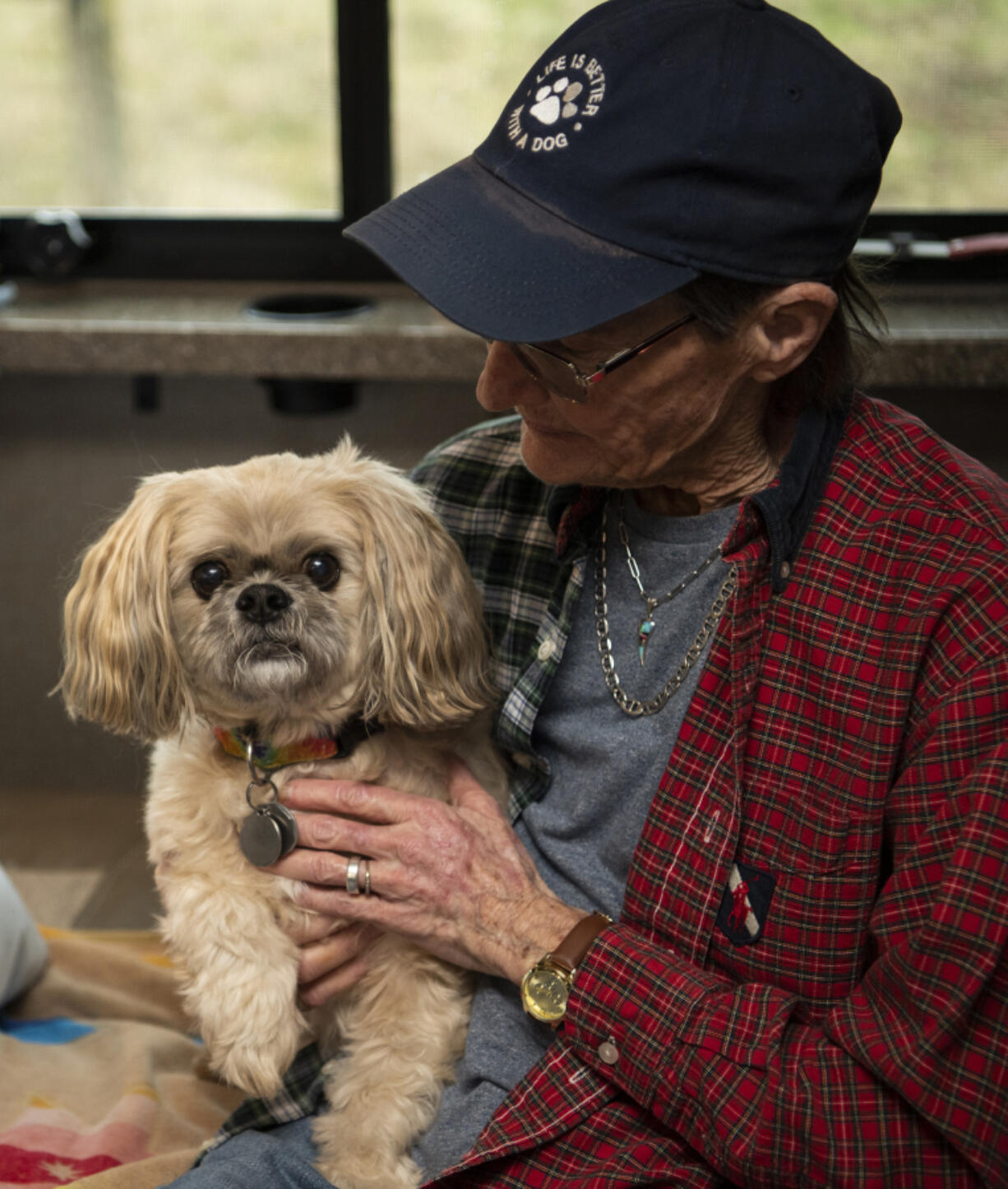 Kathy Driver holds her 11-year-old Shih Tzu Cooper. Driver&rsquo;s spouse died in 2022, and she could no longer stay in the home they shared.