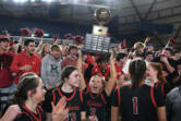 Camas senior Riley Sanz (3) lifts the state championship trophy in front of the Camas student section Saturday, March 2, 2024, after the Papermakers’ 57-41 win against Gonzaga Prep in the 4A WIAA State Basketball championship game at the Tacoma Dome.