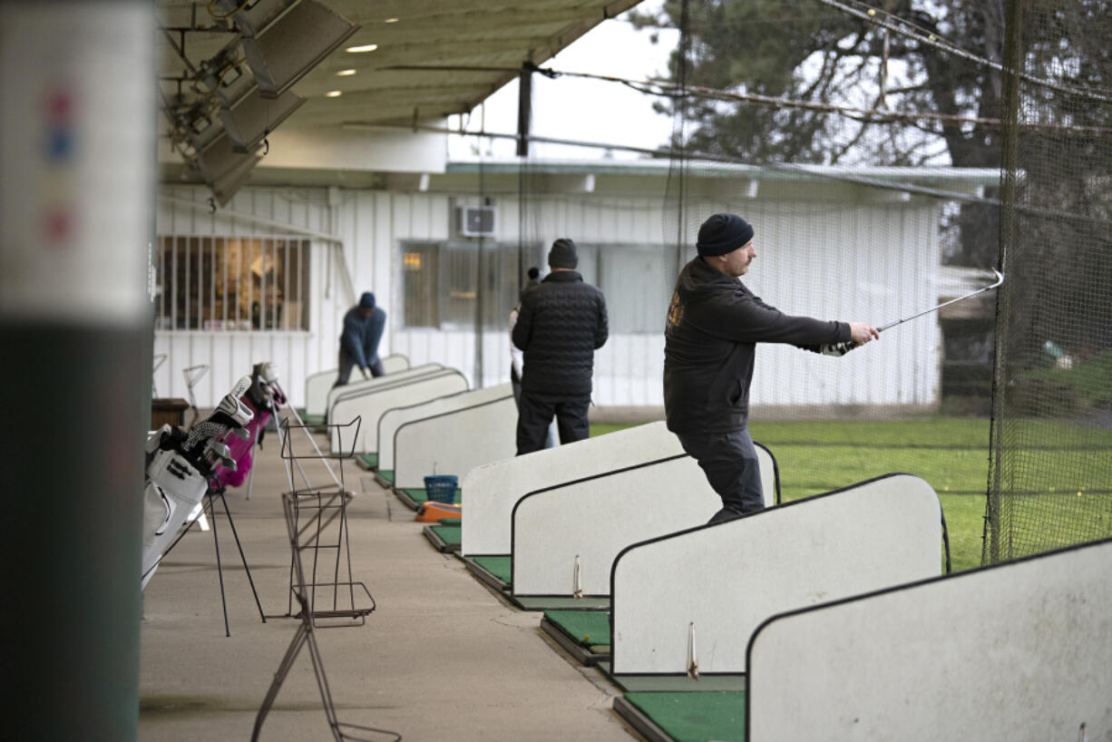 Vancouver golfer Ben Sims works on his swing while playing at the Vanco Golf Range. The facility is closing at the end of October as the city did not renew its lease.