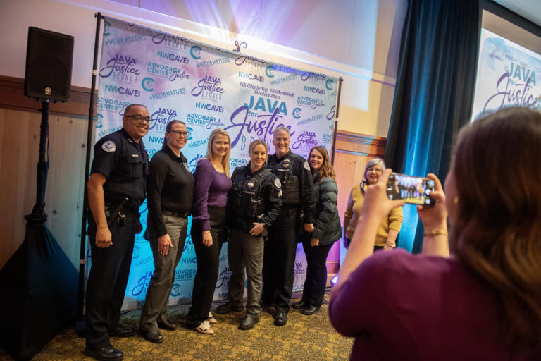 Kidnapping survivor Elizabeth Smart, third from left, poses for photos with guests of the Java For Justice Brunch at the Heathman Lodge on Friday morning, March 8, 2024. Friday was International Women's Day.