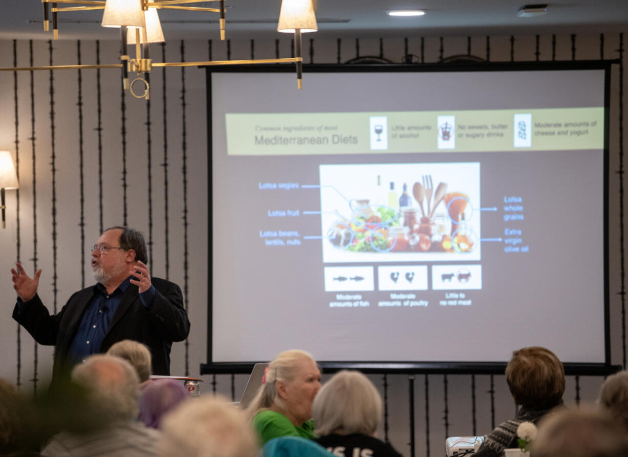 Brain researcher John Medina gives a lecture on the effects of food and exercise on cognitive ability to residents at The Park at University Village, an assisted and independent living home in the Vancouver area.