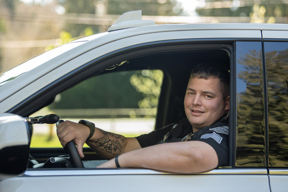 Clark County sheriff&rsquo;s Sgt. Greg Agar takes a break Thursday while on patrol at Hazel Dell Community Park. Agar was awarded recently for multiple instances of risking his own safety on the job and going above and beyond to help county citizens, even when it wasn&rsquo;t part of his job.