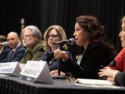 Rep. Monica Stonier, D-Vancouver, second from right, joins fellow lawmakers as she speaks to the crowd during the 2024 Legislative Review at the Hilton Vancouver Washington on Wednesday morning.