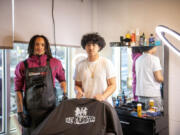 Kigen Windey, 16, left, and Kaesohn Prom, 18, stand for a portrait at The Foundation&rsquo;s barbershop at The Foundation nonprofit in Vancouver.