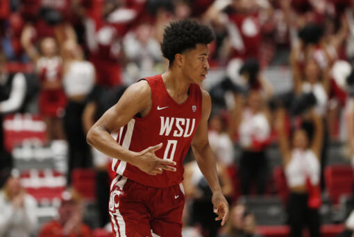 Washington State forward Jaylen Wells gestures after scoring during the first half of an NCAA college basketball game against UCLA, Saturday, March 2, 2024, in Pullman, Wash.