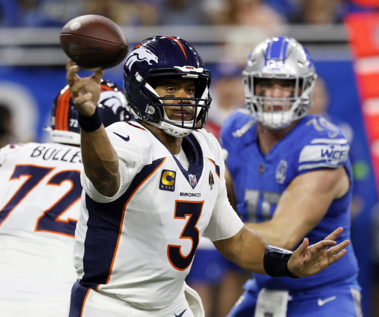 FILE - Denver Broncos quarterback Russell Wilson (3) throws during the first half of an NFL football game against the Detroit Lions, Dec. 16, 2023, in Detroit. The Broncos told Wilson, Monday, March 4, 2024, that they are going to release him next week, just 18 months after signing the Super Bowl-winning quarterback to a five-year, $242 million contract extension.