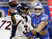 FILE - Denver Broncos quarterback Russell Wilson (3) throws during the first half of an NFL football game against the Detroit Lions, Dec. 16, 2023, in Detroit. The Broncos told Wilson, Monday, March 4, 2024, that they are going to release him next week, just 18 months after signing the Super Bowl-winning quarterback to a five-year, $242 million contract extension.
