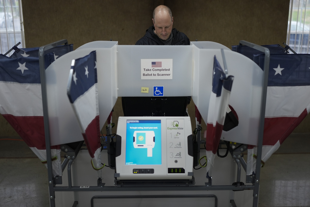 Doug Scopel votes a ballot at a polling place, Tuesday, March 5, 2024, in Nashville, Tenn. Super Tuesday elections are being held in 16 states and one territory. Hundreds of delegates are at stake, the biggest haul for either party on a single day.
