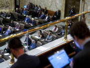 FILE - People watch House floor proceedings from the gallery on the first day of the legislative session at the Washington state Capitol, Monday, Jan. 8, 2024, in Olympia, Wash. In a busy, 60-day Washington state legislative session, lawmakers made bipartisan strides to address the opioid crisis and tweak policing practices but fell short in getting some of the most anticipated progressive bills across the finish line. The session ended Thursday, March 7 with over 300 bills heading to Democratic Gov. Jay Inslee's desk.