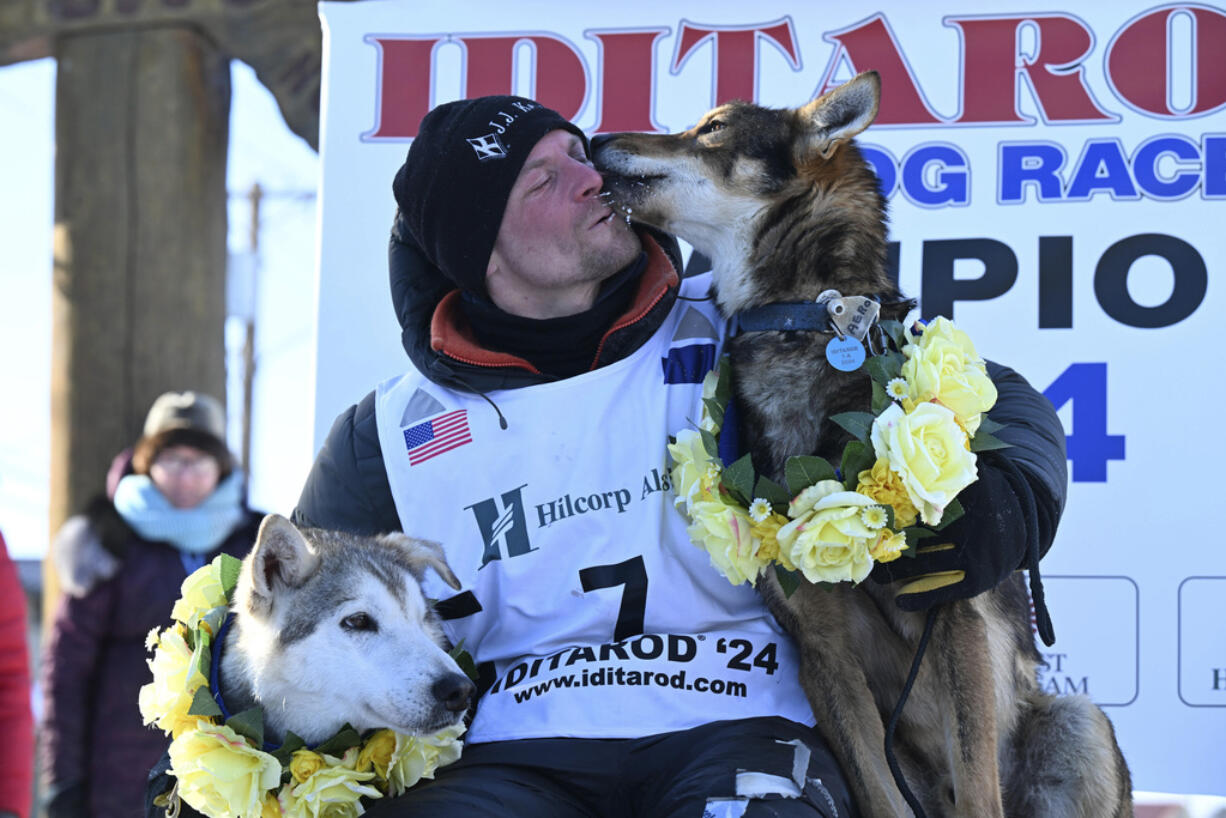 Dallas Seavey celebrates his win in the Iditarod Trail Sled Dog Race, Tuesday, March 12, 2024, in Nome, Alaska.
