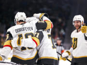 Vegas Golden Knights left wing Pavel Dorofeyev, left, celebrates after scoring a goal with center William Karlsson during the second period in an NHL hockey game against the Seattle Kraken Tuesday, March 12, 2024, in Seattle.
