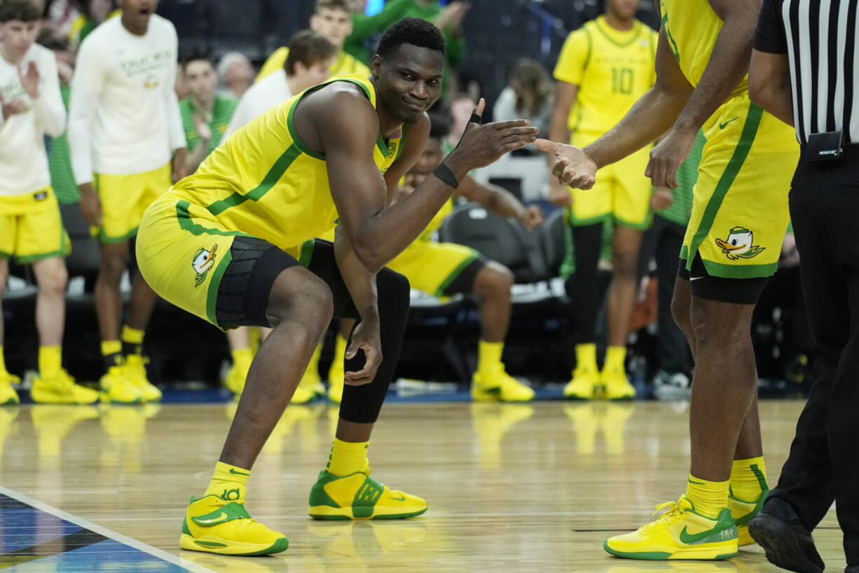 Oregon center N'Faly Dante (1) celebrates after a play against UCLA during the second half of an NCAA college basketball game in the quarterfinal round of the Pac-12 tournament Thursday, March 14, 2024, in Las Vegas.
