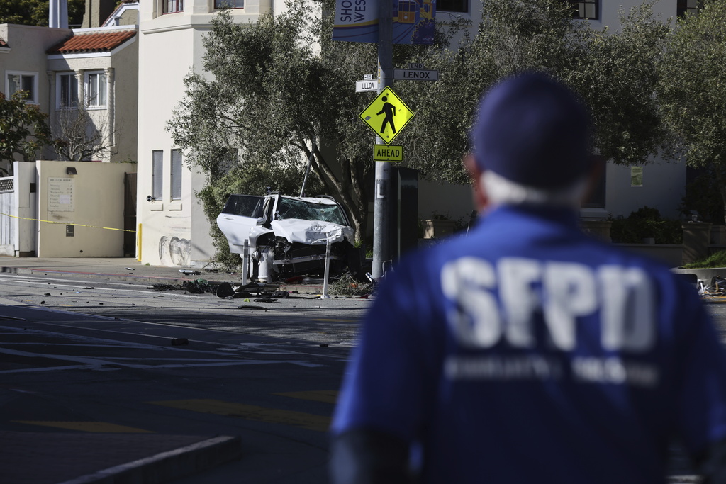 The area around a bus stop near Muni's West Portal Station is fenced off after a sport utility vehicle crashed into the stop, killing multiple people and injuring others, Saturday, March 16, 2024.