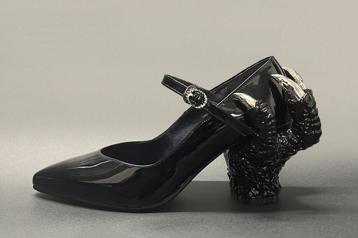 This photo provided by Ryosuke Matsui shows one of the shoes with a Godzilla-themed design by Matsui, taken in Tokyo in October 2023. Those shoes were worn by filmmakers and actors of “Godzilla Minus One” during the Oscars. One Japanese creation grabbing attention on the Oscars red carpet wasn't a movie: the kitsch shoes that seemed to be clenched in Godzilla's claw. They were the work of Matsui, who recently described his joy at seeing “Godzilla Minus One” director Takashi Yamazaki and his Shirogumi special-effects team walk the red carpet and win the visual effects Oscar, all while wearing his shoes.