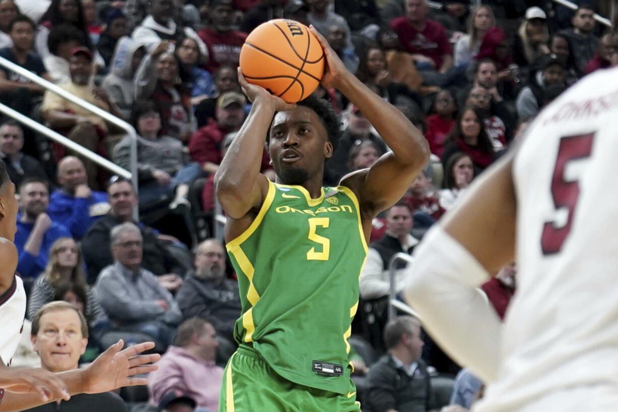 Oregon's Jermaine Couisnard (5) shoots against South Carolina during the second half of a college basketball game in the first round of the NCAA men's tournament Thursday, March 21, 2024, in Pittsburgh.
