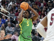 Oregon's Jermaine Couisnard (5) shoots against South Carolina during the second half of a college basketball game in the first round of the NCAA men's tournament Thursday, March 21, 2024, in Pittsburgh.
