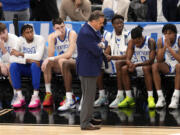 Kentucky coach John Calipari, center, stands in front of the bench late in the second half of the team's basketball game against Oakland in the first round of the men's NCAA Tournament in Pittsburgh, Thursday, March 21, 2024. Oakland won 80-76. (AP Photo/Gene J.