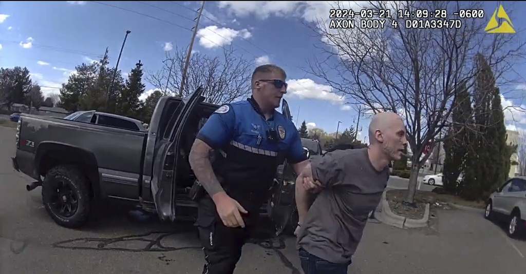 In this photo made from body camera footage and released by the Twin Falls, Idaho, Police Department, Skylar Meade, right, is arrested in Twin Falls on Thursday, March 21, 2024. Police said Meade, an Idaho prison inmate, escaped from custody when an accomplice ambushed corrections officers who were preparing to transport him back to prison from a hospital in Boise on Wednesday, March 20. Authorities say Meade and his accomplice, Nicholas Umphenour, may have been responsible for the killings of two men in northern Idaho while on the run.