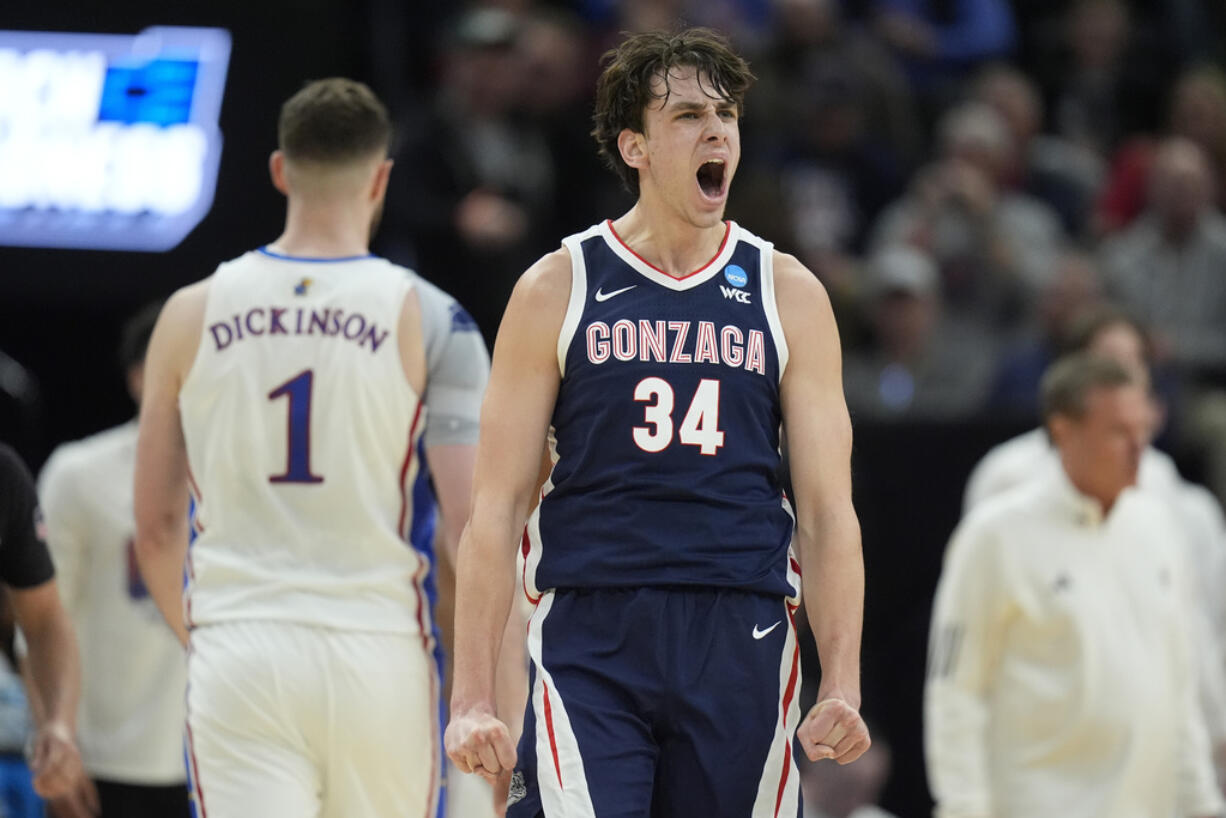 Gonzaga forward Braden Huff (34) reacts after dunking against Kansas during the first half of a second-round college basketball game in the NCAA Tournament in Salt Lake City, Saturday, March 23, 2024.