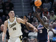 Purdue center Zach Edey (15) and Gonzaga forward Graham Ike (13) reach for the rebound during the first half of a Sweet 16 college basketball game in the NCAA Tournament, Friday, March 29, 2024, in Detroit.