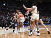 Texas forward Aaliyah Moore (23) looks to shoot against Gonzaga during the first half of a Sweet 16 college basketball game in the women's NCAA Tournament, Friday, March 29, 2024, in Portland, Ore.