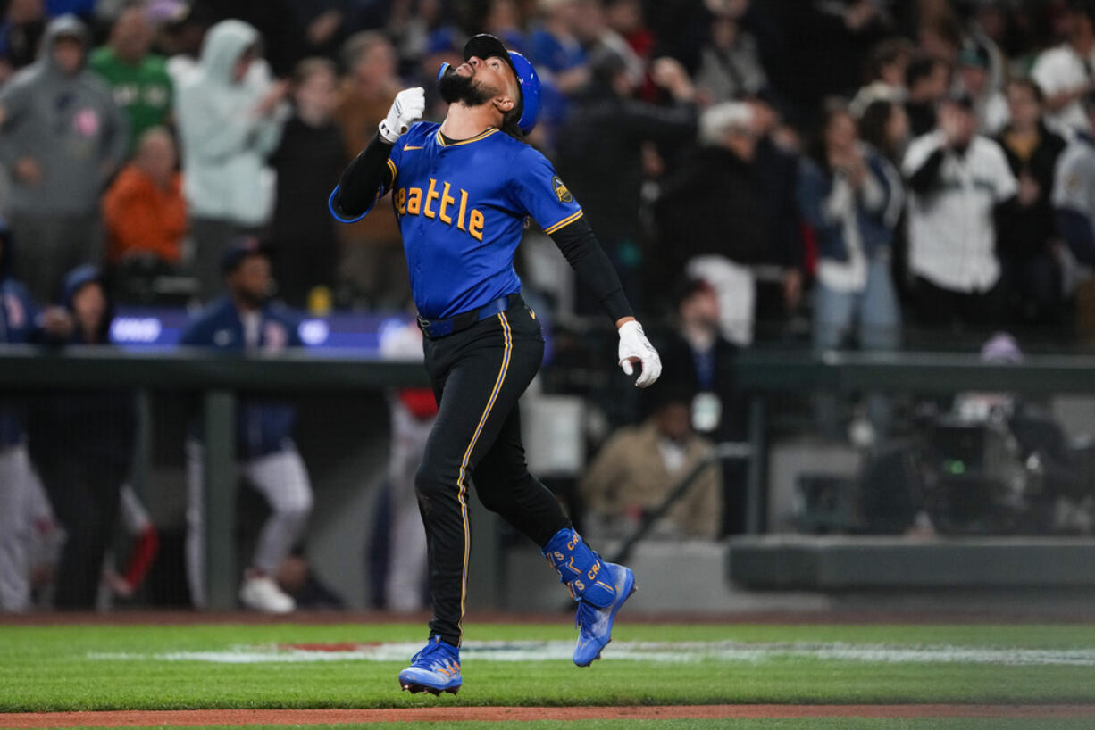 Seattle Mariners' J.P. Crawford jogs home after hitting a solo home run against the Boston Red Sox during the sixth inning of a baseball game Friday, March 29, 2024, in Seattle.
