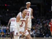 Alabama guard Mark Sears (1) celebrates after scoring during the first half of an Elite 8 college basketball game against Clemson in the NCAA tournament Saturday, March 30, 2024, in Los Angeles.