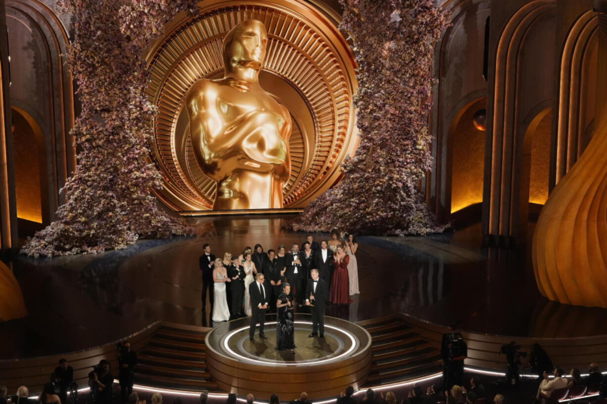 The cast and crew of &ldquo;Oppenheimer&rdquo; accept the award for best picture during the Oscars on Sunday, March 10, 2024, at the Dolby Theatre in Los Angeles.