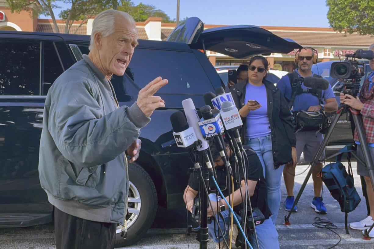 Former Trump White House official Peter Navarro speaks to reporters before he heads to prison, Tuesday, March 19, 2024 in Miami, to begin serving his sentence for refusing to cooperate with a congressional investigation into the Jan. 6, 2021, attack on the U.S. Capitol.