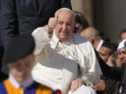 Pope Francis smiles as he waves faithful at the end of his weekly general audience in St. Peter&rsquo;s Square, at the Vatican, Wednesday, March 20, 2024.