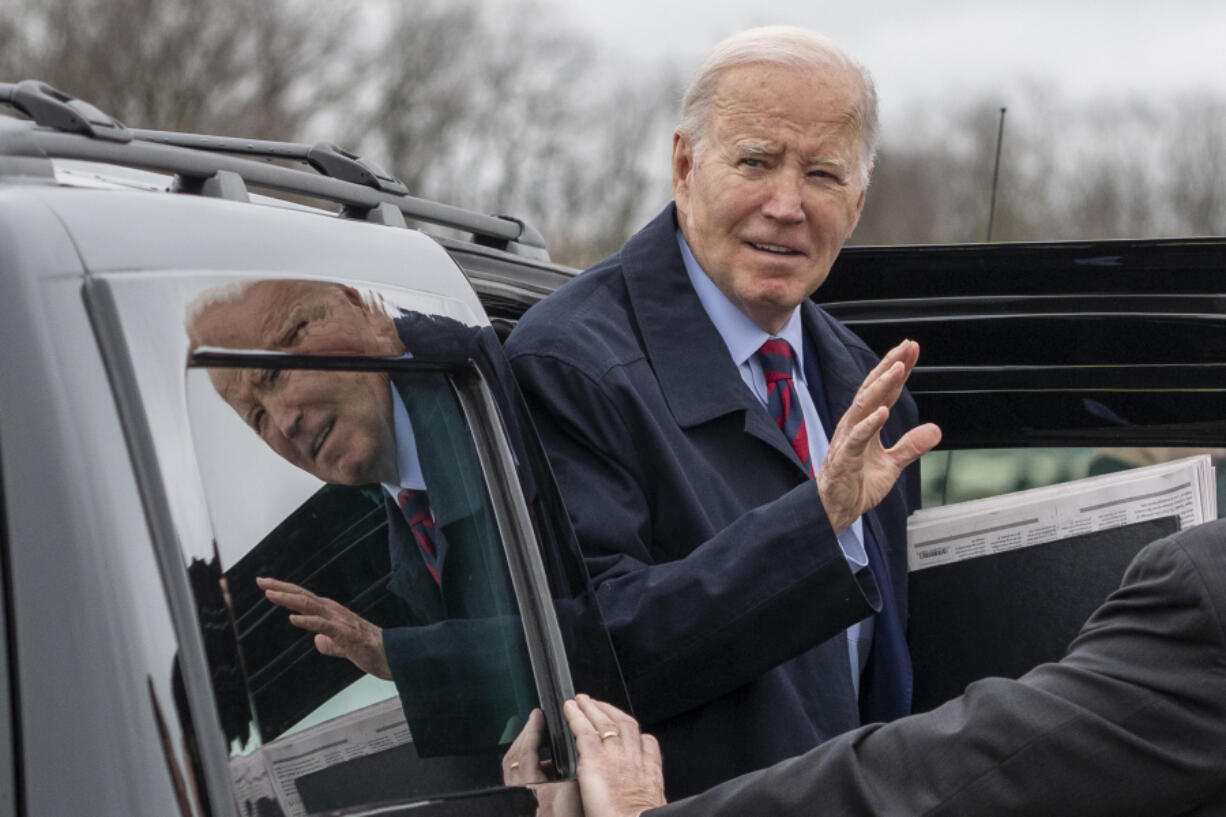 President Joe Biden waves before speakiing with reporters as he boards Air Force One, Tuesday, March 5, 2024, in Hagerstown, Md. The President is traveling to Washington.