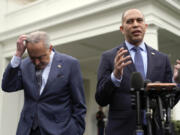 House Minority Leader Hakeem Jeffries, D-N.Y., speaks as Senate Majority Leader Chuck Schumer of N.Y., listens outside the West Wing after meeting with President Joe Biden at the White House in Washington, Tuesday, Feb. 27, 2024.
