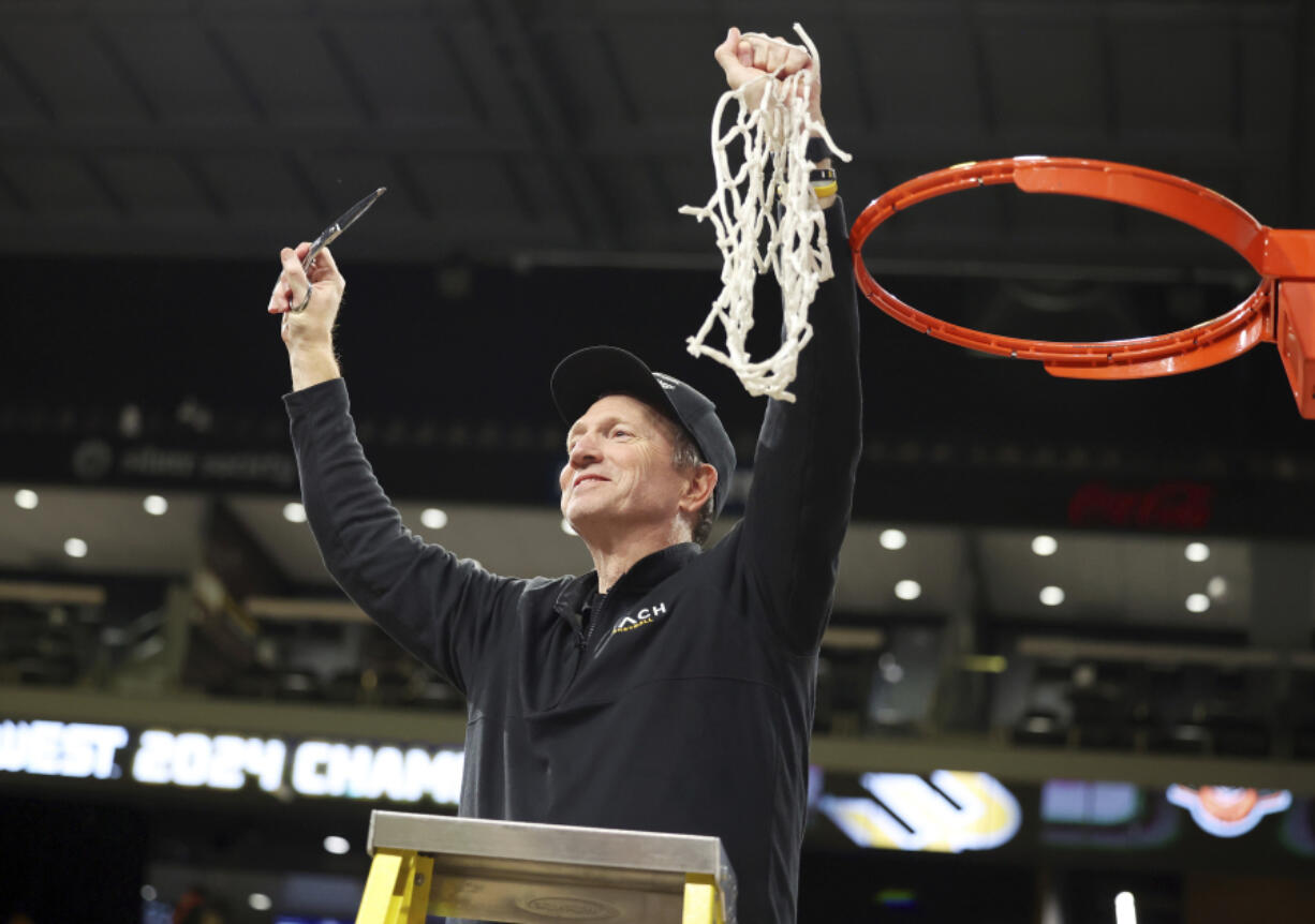Long Beach State head coach Dan Monson participates in a net cutting ceremony after his team played an NCAA college basketball game against UC Davis in the championship of the Big West Conference men&rsquo;s tournament Saturday, March 16, 2024, in Henderson, Nev. Long Beach State won 74-70.