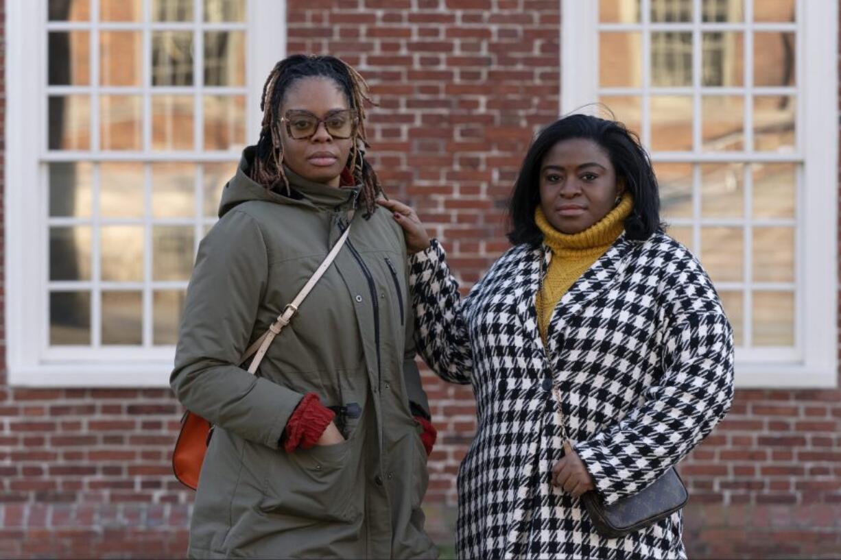 Charity Wallace, left, and Chassity Coston pose in Harvard Yard at Harvard University, Saturday, Feb. 24, 2024, in Cambridge, Mass. With attacks on diversity, equity and inclusion initiatives raging on, Black women looking to climb the work ladder are seeing a landscape that looks more hostile than ever.