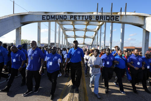 Hundreds of people walk across the Edmund Pettus Bridge commemorating the 59th anniversary of the Bloody Sunday voting rights march in 1965, Sunday, March 3, 2024, in Selma, Ala.