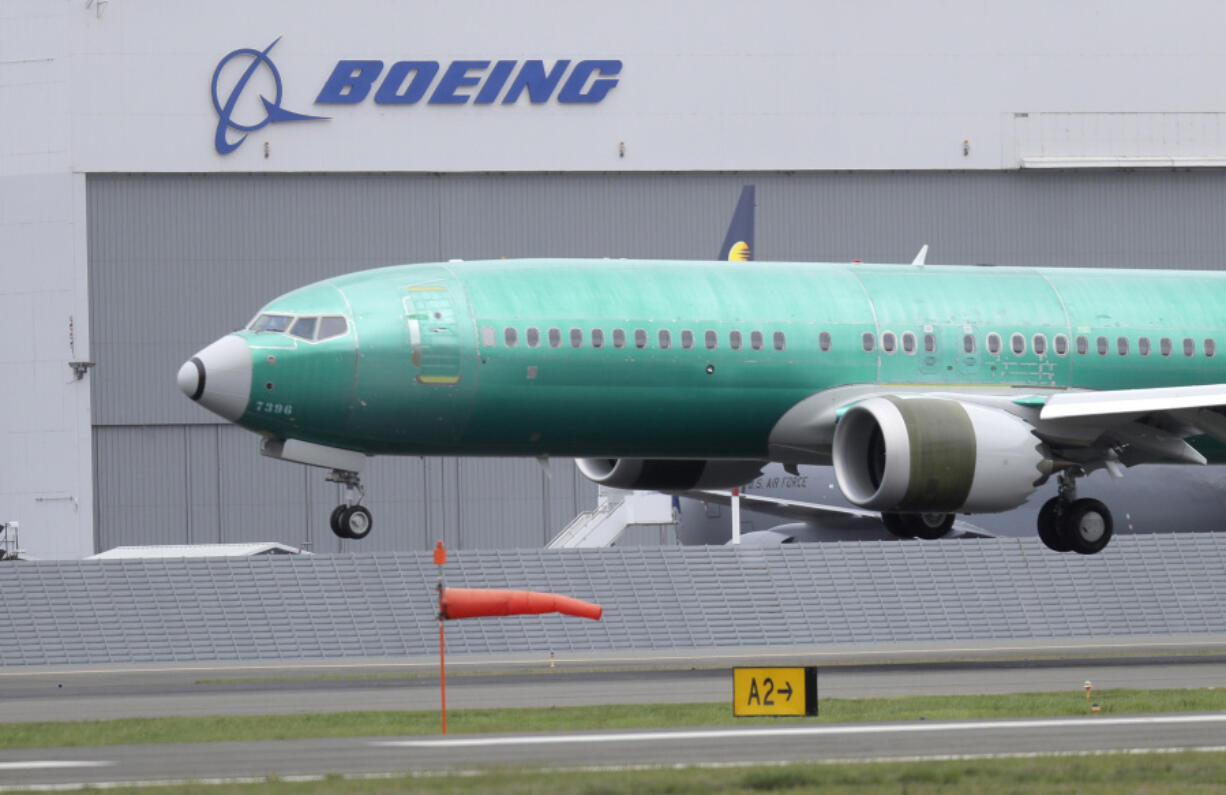 FILE - In this April 10, 2019, file photo, a Boeing 737 Max 8 airplane lands following a test flight at Boeing Field in Seattle. Federal investigators have confirmed in a report Thursday, March 7, 2023, an account by pilots who say the rudder controls on their Boeing Max jetliner failed during a landing last month. (AP Photo/Ted S.